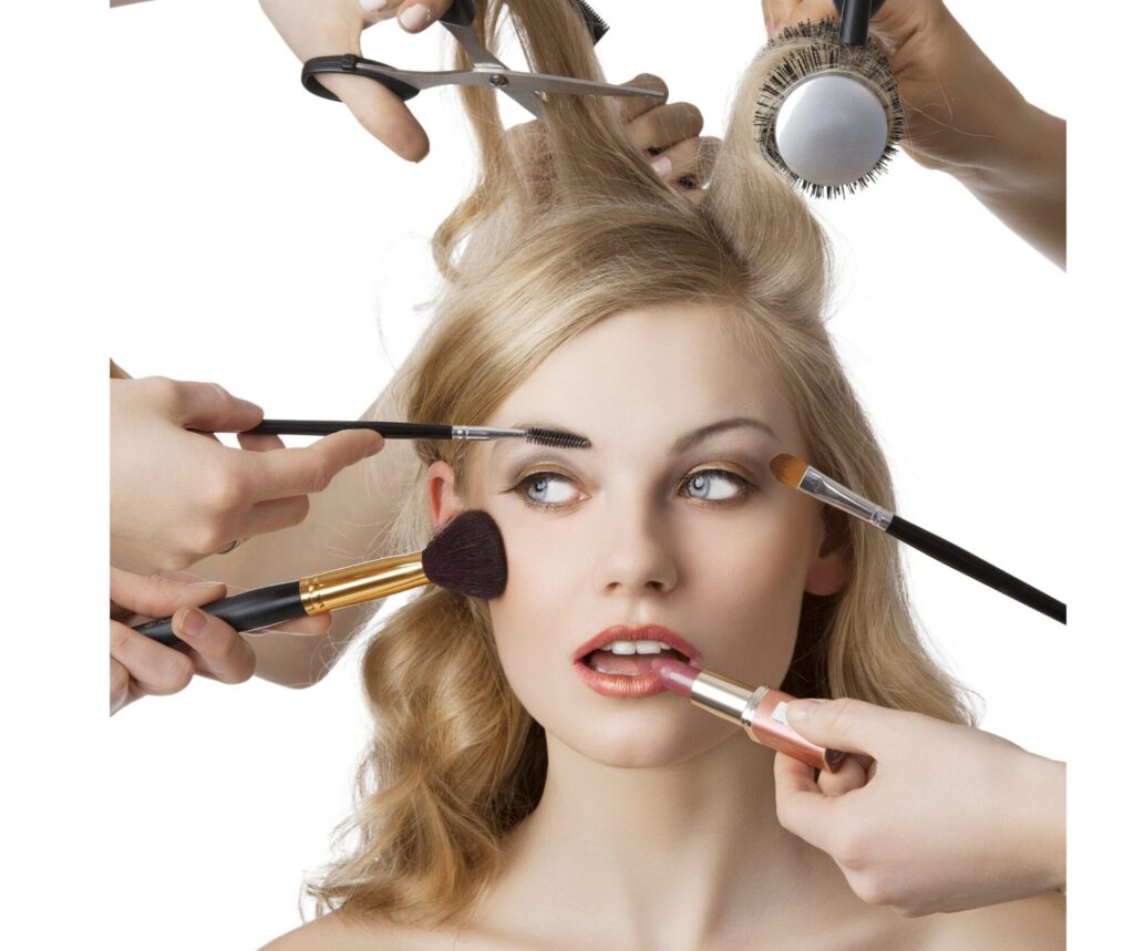 Blond female with multiple hands around head and face providing a variety of beauty and hair services